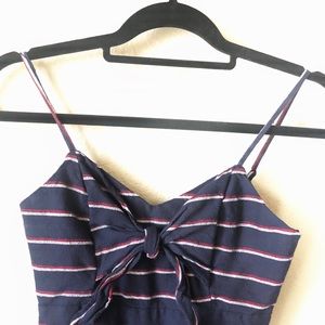 Navy blue pant suit with maroon /white stripes.